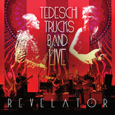 the album cover for Tedeschi Trucks Band - Live Revelator [Fire Orange with Black Swirl]