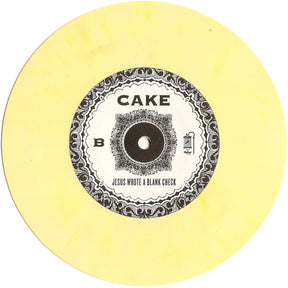 Cake : Sheep Go To Heaven / Jesus Wrote A Blank Check (7", RSD, Single, Ltd, Yel)