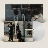 the album cover for Ezra Collective - Here Because Of Hope [Indie Exclusive Translucent White]