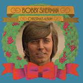 the album cover for Bobby Sherman - Bobby Sherman Christmas Album [Clear Vinyl] [Limited Edition] (Red)