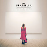 the album cover for Fratellis - Eyes Wide Tongue Tied - Red/White Sunburst [Colored Vinyl]